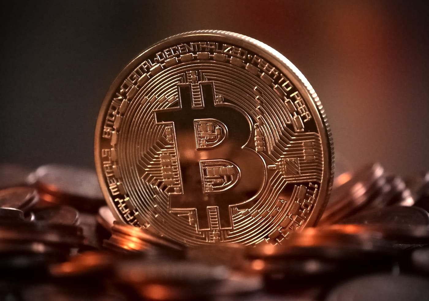 this picture shows a bitcoin coin in physical metal form. 